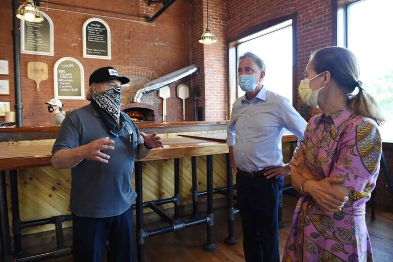 Gov. Ned Lamont and Lt. Gov. Susan Bysiewicz get a tour of 5 Churches Brewing in New Britain from owner Peter Lemnotis (left) in October.