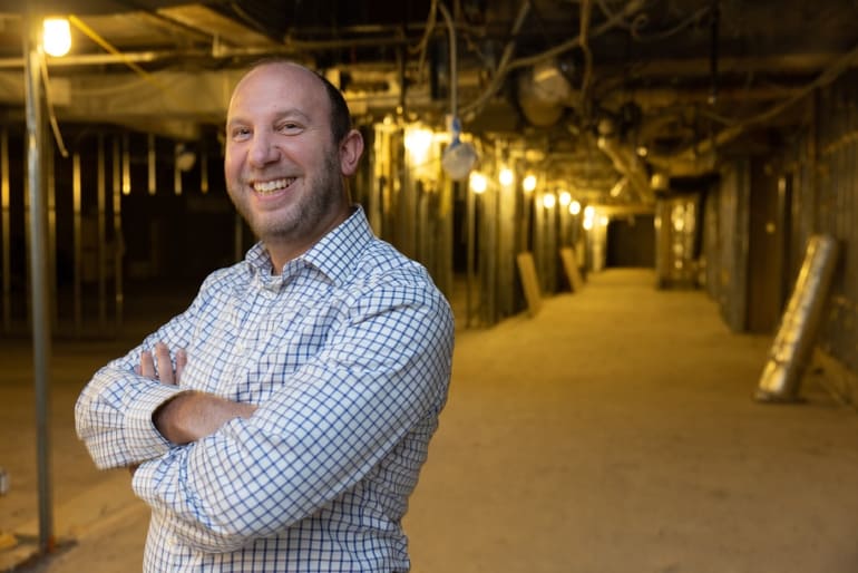 Developer Yitz Rabinowitz inside The Millennium, a former hotel at 50 Morgan St. in Hartford, that his company, the Axela Group, is converting into apartments in partnership with Shelbourne Global Solutions.