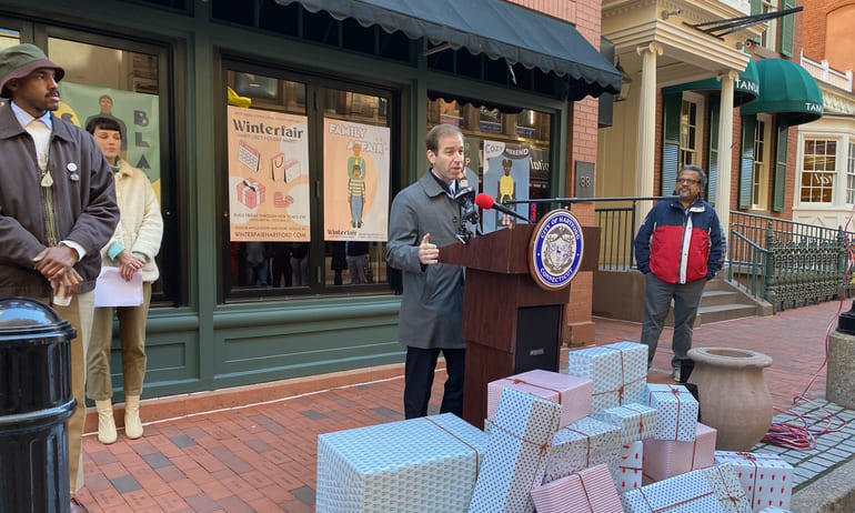Hartford Mayor Luke Bronin announces the coming 'Winterfair' holiday market during a press conference on Pratt Street.